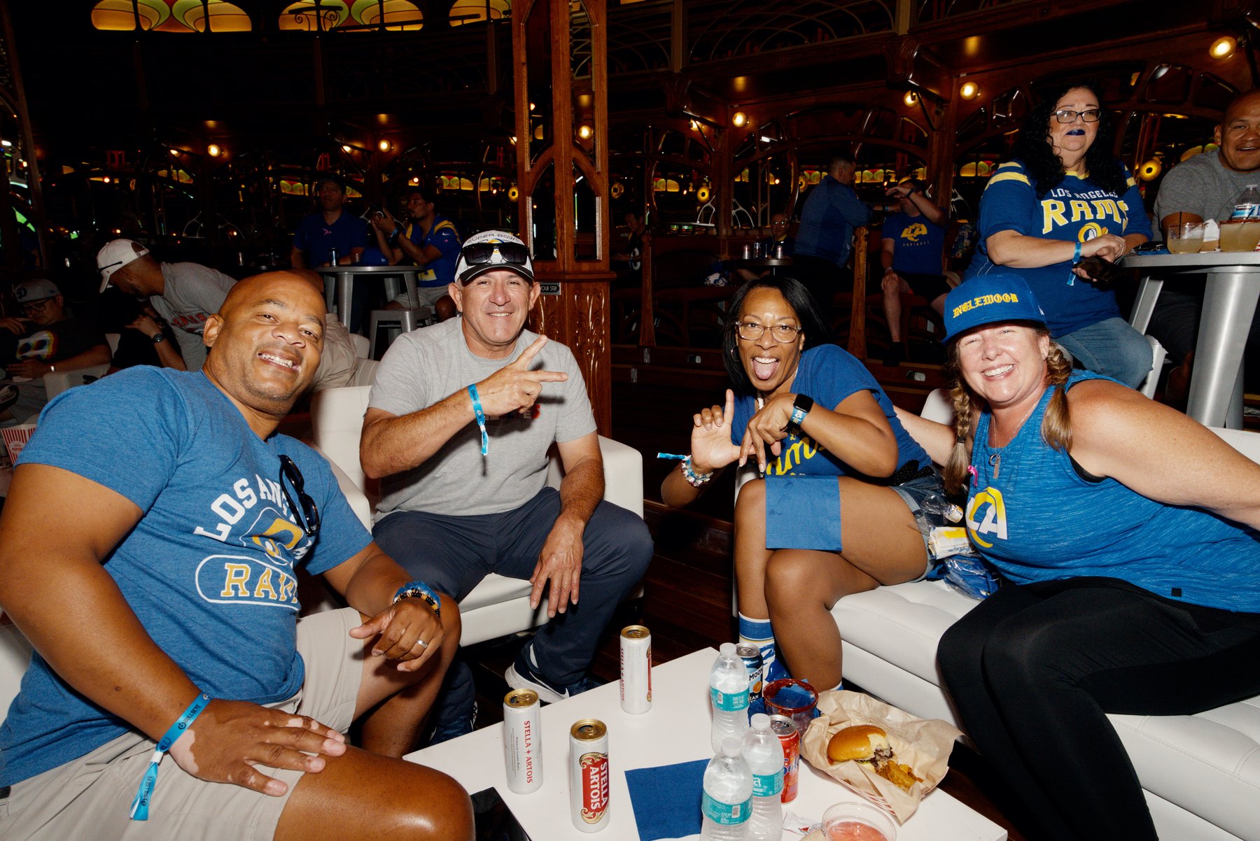 Fans gathered around a table during a night activation