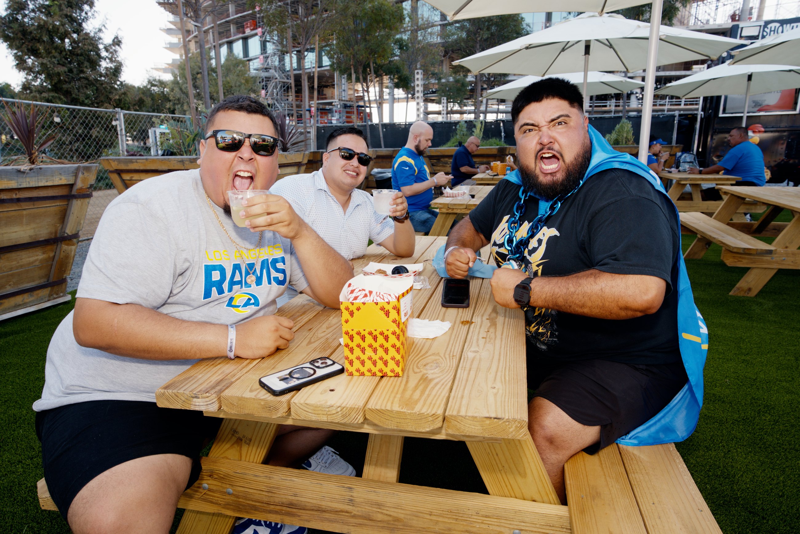 Rams fans eating together at a patio activation