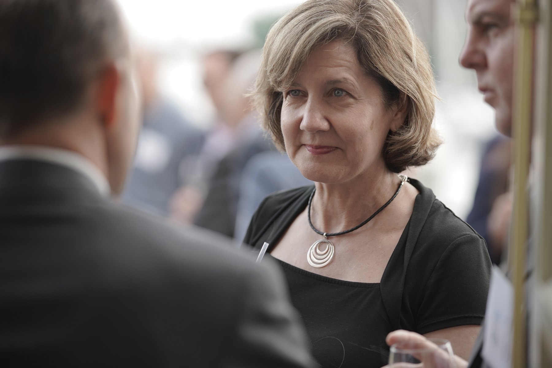 A guest listening closely during a corporate event