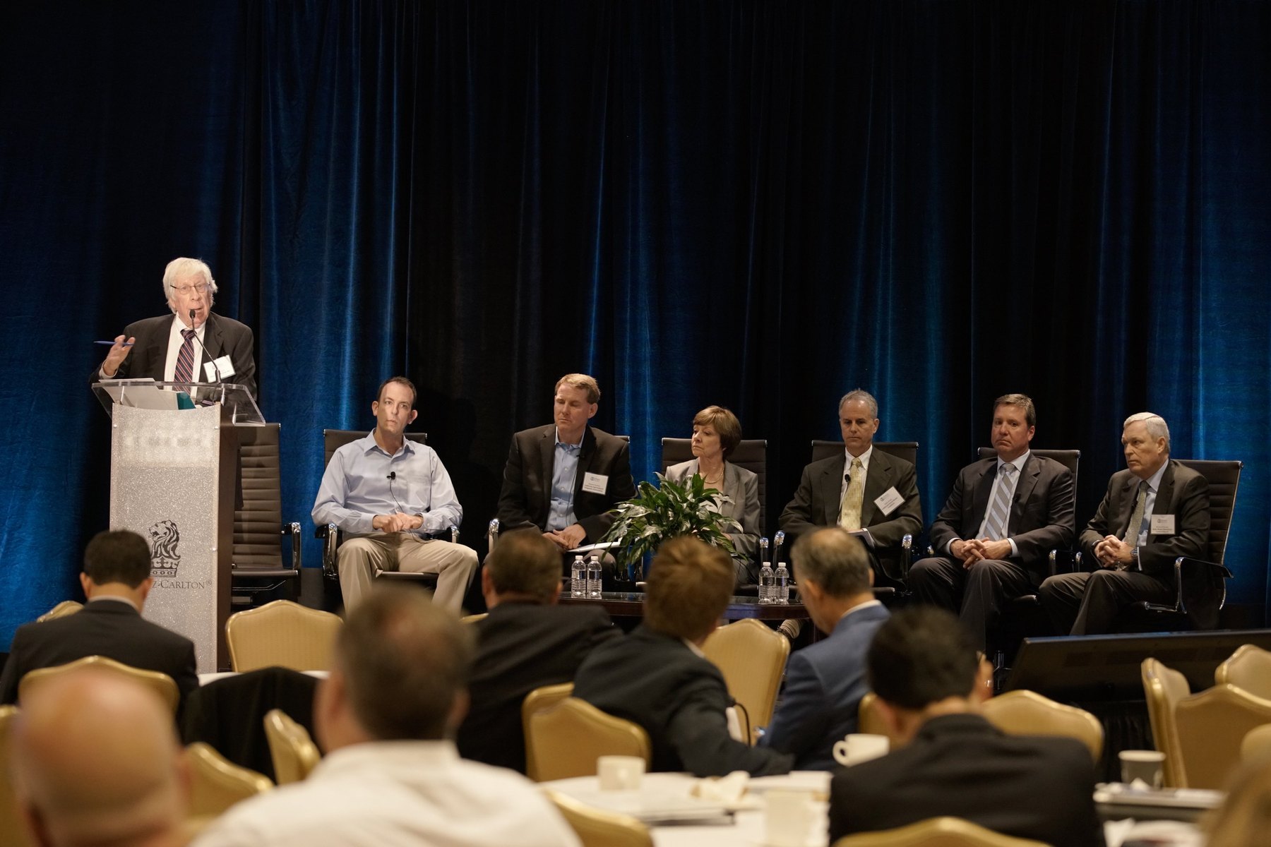 Corporate panel discussion in a hotel ballroom