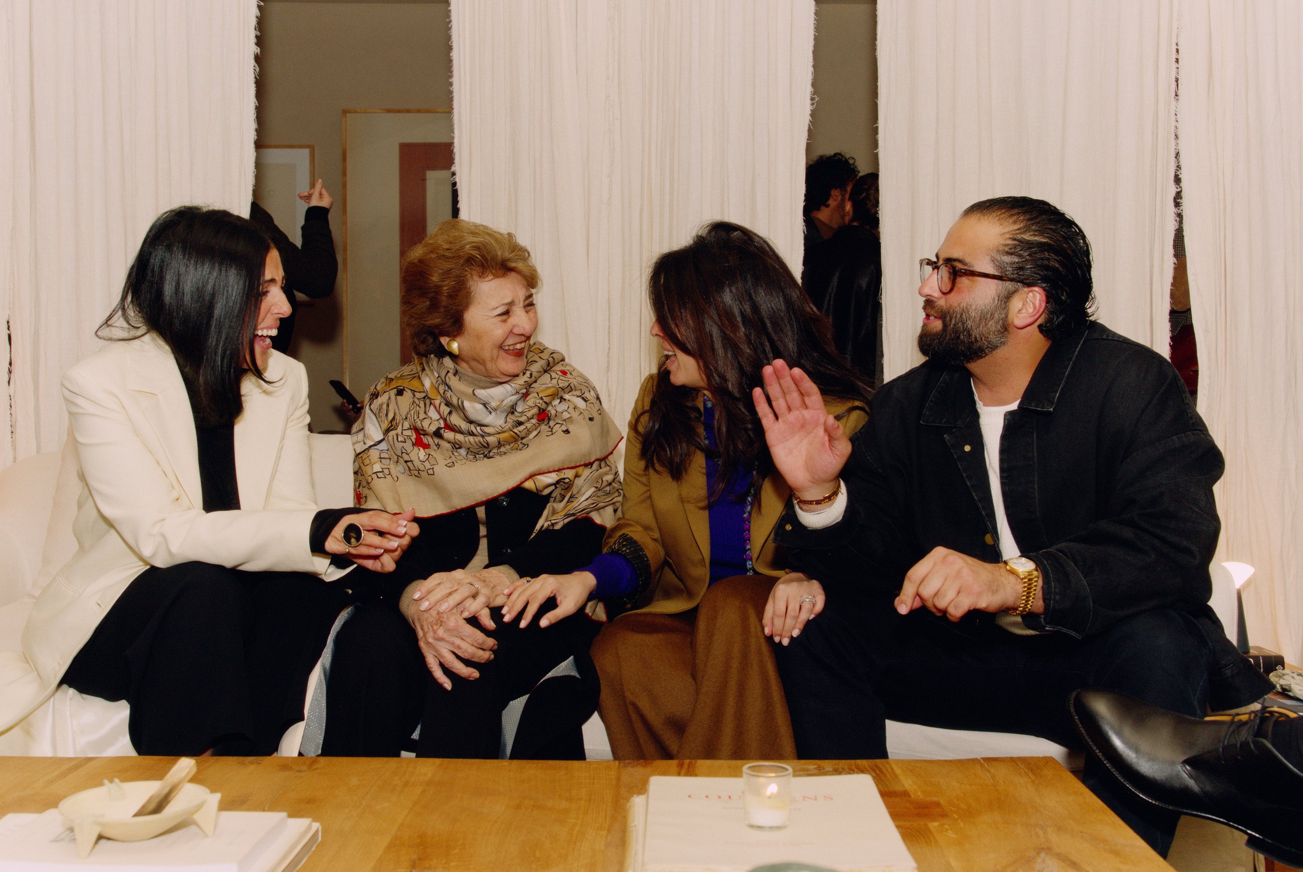 Guests talking together on a sofa at House of Leon