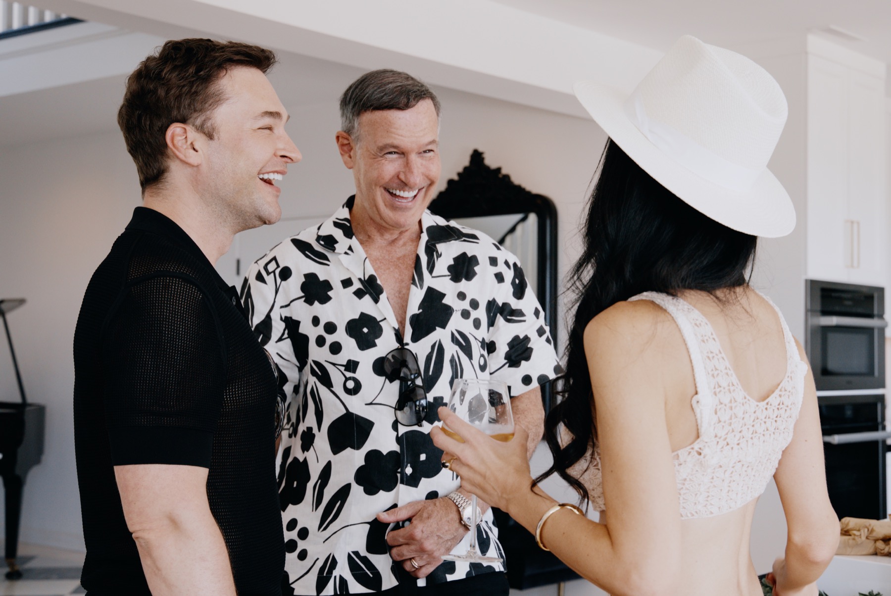 Guests laughing together during a private hospitality event