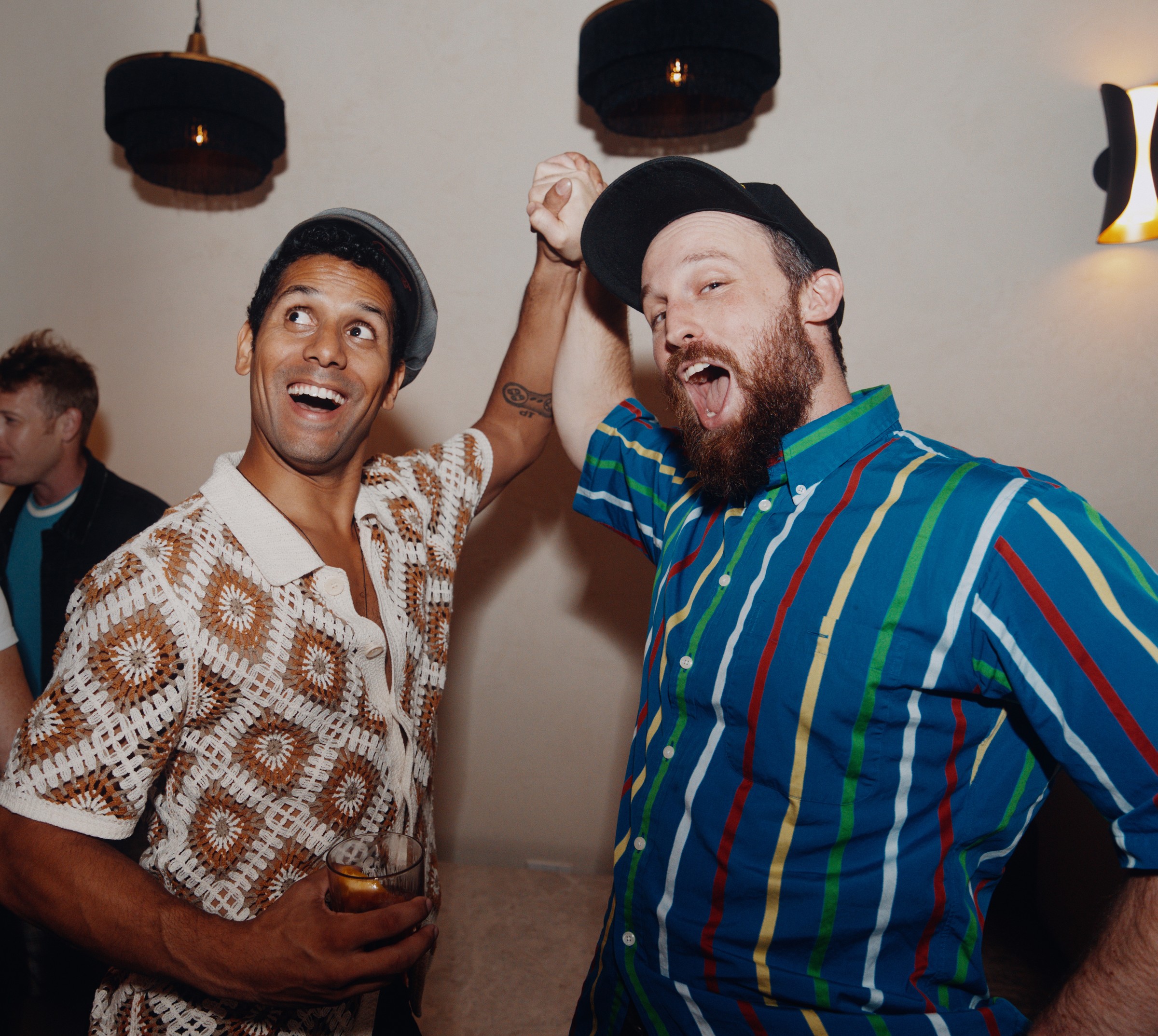 Two guests reacting joyfully at a social event